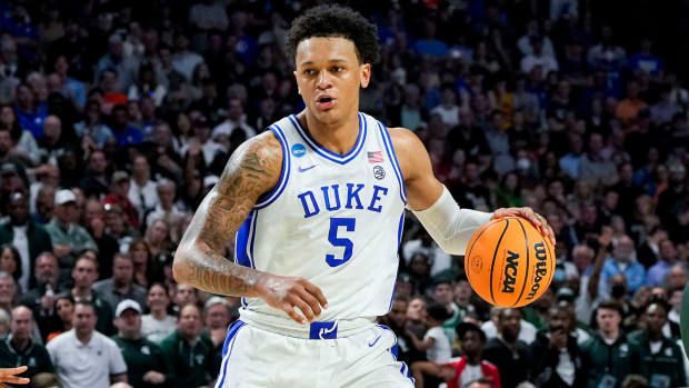 Duke Blue Devils forward Paolo Banchero (5) carries the ball against the Michigan State Spartans in the second half during the second round of the 2022 NCAA Tournament.